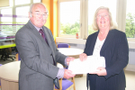 Ivan Ould CC hands Lesley Pendleton the 1,000 name petition