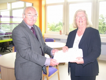 Ivan Ould CC hands Lesley Pendleton the 1,000 name petition